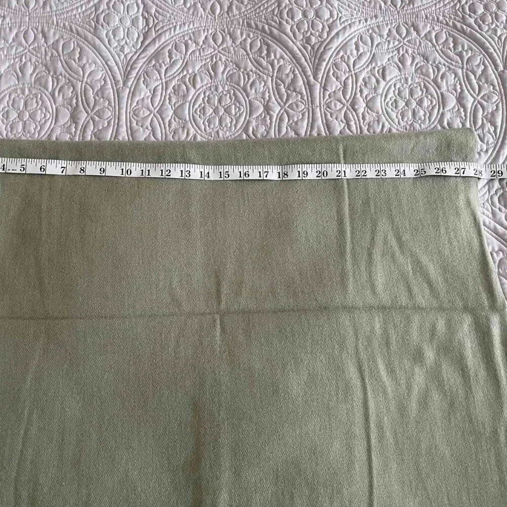 The soft warm pistachio-colored scarve made of a mixture of acrylic and cashmere